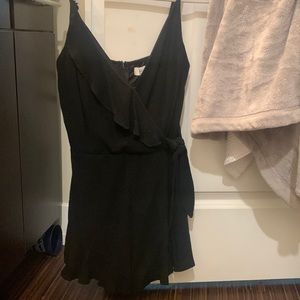 I’m selling the She + Sky Woven Cami black romper! Never been worn!